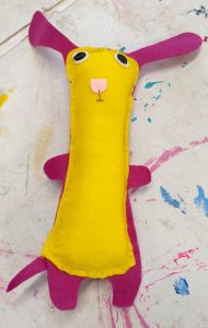 Student made tall dog plush toy